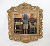 Rococo style carved mirror in natural finish with focal cherub