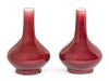 * A Small Pair of Sang-de-Boeuf Glazed Porcelain Vases Height 4 1/2 inches.