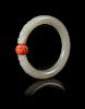 A Carved Celadon Jade Bangle Diameter 3 1/4 inches.