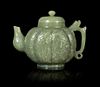 * A Celadon Jade Teapot and Cover Height 5 1/4 inches.