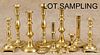 Group of brass candlesticks, 19th/20th c., together with tie backs and wall sconces