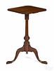 Federal cherry candlestand, ca. 1800, with a suppressed ball standard, 27'' h., 15 1/2'' w.