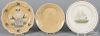Two yelloware plates, together with a creamware plate with transfer ship decoration