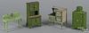 Four pieces of Arcade green color doll house furniture.