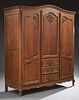 French Louis XV Style Carved Oak Armoire, 20th c.,