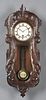 French Carved Walnut Wall Clock, late 19th c., the