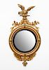 LATE FEDERAL STYLE EBONIZED AND PARCEL-GILT CONVEX MIRROR