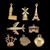 VINTAGE 9K, 14K, AND 18K YELLOW GOLD TRAVEL-THEMED FIGURAL CHARMS, LOT OF EIGHT