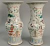 Pair of 19th/20th century Chinese famille rose phoenix tall baluster vase, decorated with roosters in a garden amongst flower