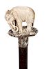 72. Stage Elephant Cane-  Early 20th Century- A finely carved standing elephant which is carved  from a colorful piece of sta