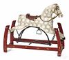 Carved and painted rocking horse, 19th c., on a platform base, 33'' l.