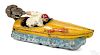 Hubley cast iron Static speed boat with waves, a seated driver, and outboard motor, 9 3/4'' l.