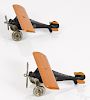 Pair of Arcade cast iron The Monocoupe airplanes with nickel-plated propellers, 8 1/2'' wingspan.