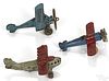 Three small cast iron airplanes, to include an Arcade The Monocoup, a Kilgore N4, and a Hubley