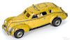 Arcade cast iron yellow cab with a painted driver and a passenger, 8'' l.