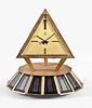 A mid 20th century solar powered pyramid form table clock signed Montre Royale