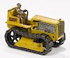 Arcade cast iron Caterpillar tractor with a nickel-plated driver, 7 1/2'' l.