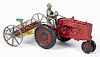 Arcade cast iron Farmall tractor, with a rake and a nickel-plated driver, tractor - 7'' l.