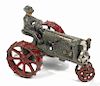 Arcade cast iron McCormick Deering Farmall tractor with a painted driver