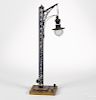 Bing painted tin electric trestle railroad lamp with a hand crank and wood base, 18 1/2'' h.