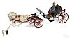 Pratt & Letchworth cast iron horse drawn open Phaeton carriage with a painted driver, 17'' l.