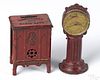 Two cast iron still banks, to include a street Clock Bank, 6'' h., and a Kenton Templeton Radio