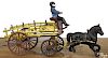 Wilkins cast iron horse drawn stake wagon with original driver, 13'' l.