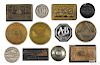 Twelve cast iron advertising paperweights, to include Pictet Ice Refrigerating Machines