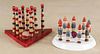 Two painted wood skittles sets, 20th c., one in the form of gnomes, 5 3/4'' h.