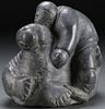 SOAPSTONE CARVED INUIT FIGURE WITH WALRUS