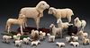 A COLLECTION OF 21 VINTAGE SHEEP FIGURES