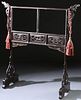 A CHINESE CARVED AND EBONIZED GARMENT STAND