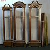 Six tall case clock cases with chimes.