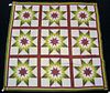 Pieced quilt, late 19th c., with 9 stars, red cali