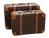 * A Pair of Louis Vuitton Hardsided Suitcases, Smaller Suitcase is 17.5 x 8" x 27", Larger Suitcase is 20" x 9.5" x 31".