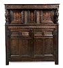 * A Jacobean Carved Oak Court Cupboard Height 63 x width 56 x depth 25 inches.