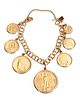 A gold coin and 14k gold charm bracelet