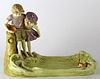 Porcelain statue depicting boy and girl