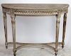 Carved and white washed demi-lune console