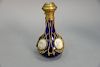 Gilt metal mounted scent bottle having five miniature paintings over cobalt blue glass. ht. 6 1/2in.