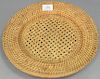 Set of thirteen Artesian rattan wicker woven charger plates (dia. 13in.), small square coaster, and wine bottle holder.