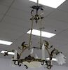 Victorian gothic style brass ten light chandelier with winged griffins over center glass dome surrounded by four arms with ca