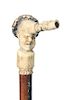 2. Stag Cheroot Holder Cane-Ca.1860- Carved stag handle with a human face and a hands on carving which doubles a cheroot hold