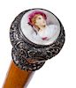 55. Victorian Dress Cane- Ca. 1870- A beautiful ornate silver handle with a photographic porcelain cartouche of a Victorian l