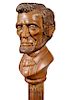 163.  Abraham Lincoln Folk Cane- Ca. 1900- A great likeness of president Lincoln with colored hair and beard, a pair of lanya