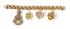 * A 14 Karat Yellow Gold Bracelet with Four Attached Charms, 95.80 dwts.