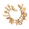 An 18 Karat Yellow Gold Bracelet with Twenty Attached Charms, 45.60 dwts.