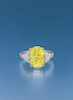 A Platinum, Yellow Gold, Fancy Yellow Diamond and Diamond Ring, 4.40 dwts.