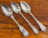 Three coin silver serving spoons, early 19th c., two bearing the touch of D. Hall