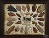 Framed group of arrowheads and trade beads, largest - 3'' l.